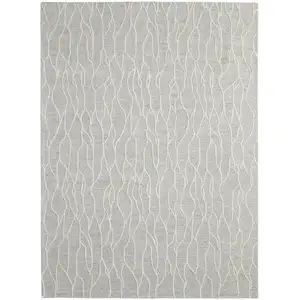 Photo of Taupe And Ivory Wool Abstract Tufted Handmade Stain Resistant Area Rug