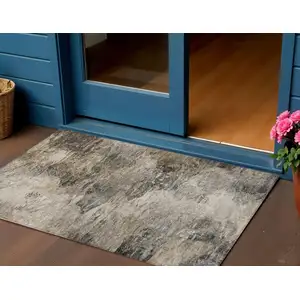 Photo of Taupe Beige And Brown Abstract Washable Indoor Outdoor Area Rug