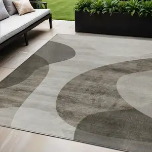 Photo of Taupe Beige And Chocolate Abstract Washable Indoor Outdoor Area Rug