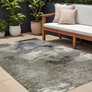 Photo of Taupe Beige And Ivory Abstract Washable Indoor Outdoor Area Rug