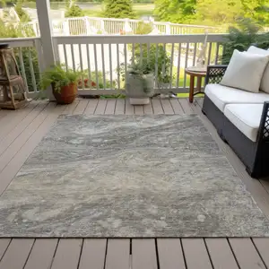 Photo of Taupe Beige And Ivory Abstract Washable Indoor Outdoor Area Rug