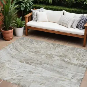 Photo of Taupe Beige And Ivory Abstract Washable Indoor Outdoor Area Rug