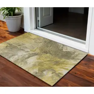 Photo of Taupe Beige And Ivory Abstract Washable Indoor Outdoor Area Rug