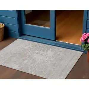 Photo of Taupe Beige And Ivory Abstract Washable Indoor Outdoor Area Rug