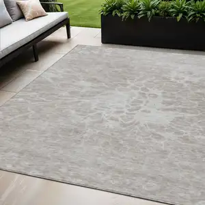 Photo of Taupe Beige And Ivory Abstract Washable Indoor Outdoor Area Rug