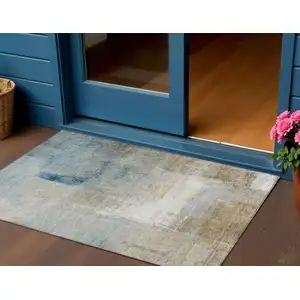 Photo of Taupe Beige And Ivory Abstract Washable Indoor Outdoor Area Rug