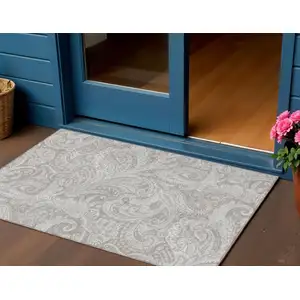 Photo of Taupe Beige And Ivory Paisley Washable Indoor Outdoor Area Rug