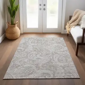 Photo of Taupe Beige And Ivory Paisley Washable Indoor Outdoor Area Rug