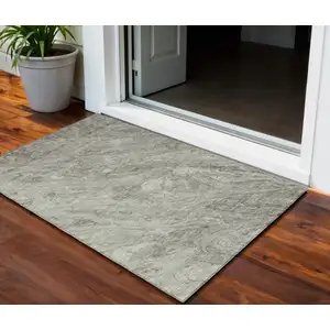 Photo of Taupe Beige And Tan Abstract Washable Indoor Outdoor Area Rug