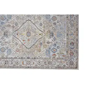 Photo of Taupe Blue And Gray Floral Stain Resistant Area Rug