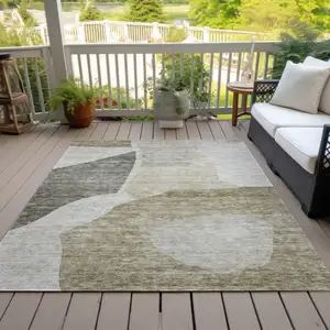 Photo of Taupe Brown And Beige Abstract Washable Indoor Outdoor Area Rug