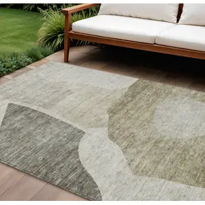 Photo of Taupe Brown And Beige Abstract Washable Indoor Outdoor Area Rug