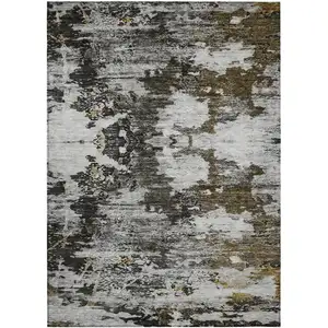 Photo of Taupe Brown And Gold Abstract Washable Indoor Outdoor Area Rug