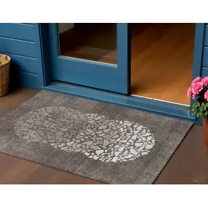 Photo of Taupe Brown And Ivory Abstract Washable Indoor Outdoor Area Rug