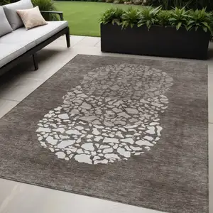 Photo of Taupe Brown And Ivory Abstract Washable Indoor Outdoor Area Rug