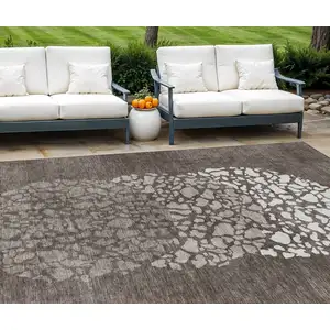 Photo of Taupe Brown And Ivory Abstract Washable Indoor Outdoor Area Rug