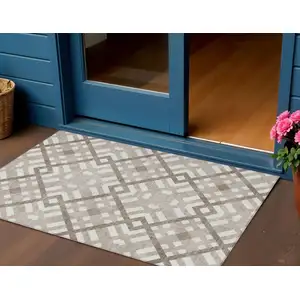 Photo of Taupe Brown And Ivory Geometric Washable Indoor Outdoor Area Rug