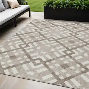 Photo of Taupe Brown And Ivory Geometric Washable Indoor Outdoor Area Rug