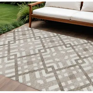 Photo of Taupe Brown And Ivory Geometric Washable Indoor Outdoor Area Rug