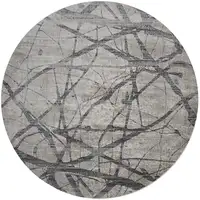 Photo of Taupe Gray And Ivory Round Abstract Stain Resistant Area Rug