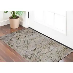 Photo of Taupe Green and Tan Abstract Power Loom Area Rug