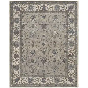 Photo of Taupe Ivory And Blue Wool Floral Tufted Handmade Stain Resistant Area Rug