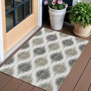 Photo of Taupe Ivory And Brown Ikat Washable Indoor Outdoor Area Rug