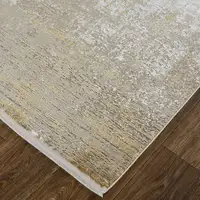 Photo of Taupe Ivory And Gold Abstract Area Rug With Fringe