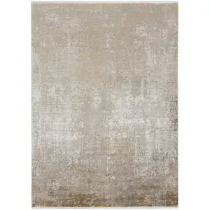 Photo of Taupe Ivory And Gold Abstract Area Rug With Fringe