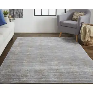 Photo of Taupe Silver And Tan Abstract Power Loom Area Rug