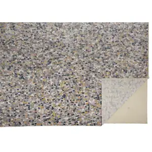 Photo of Taupe Tan And Orange Abstract Stain Resistant Area Rug