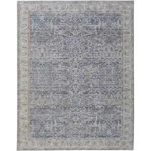 Photo of Taupe and Blue Ikat Power Loom Worn Faded Area Rug With Fringe