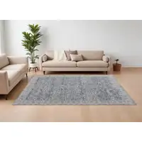 Photo of Taupe and Blue Ikat Power Loom Worn Faded Area Rug With Fringe