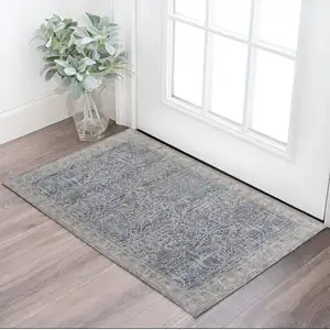 Photo of Taupe and Blue Ikat Power Loom Worn Faded Area Rug With Fringe