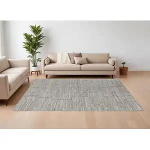 Photo of Taupe and Gray Abstract Hand Woven Worn Faded Area Rug