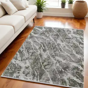 Photo of Taupe and Gray Abstract Power Loom Area Rug With Fringe