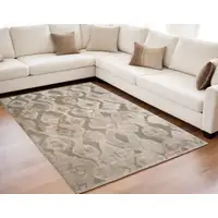 Photo of Taupe and Ivory Abstract Power Loom Worn Faded Area Rug