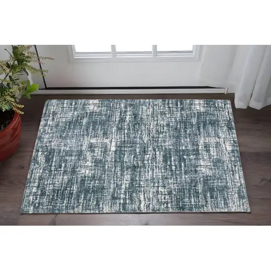 Teal And Ivory Geometric Area Rug Photo 1