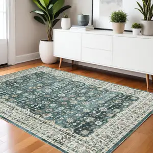 Photo of Teal And Ivory Oriental Distressed Area Rug