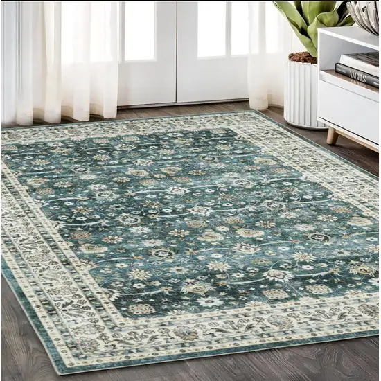 Teal And Ivory Oriental Distressed Area Rug Photo 1