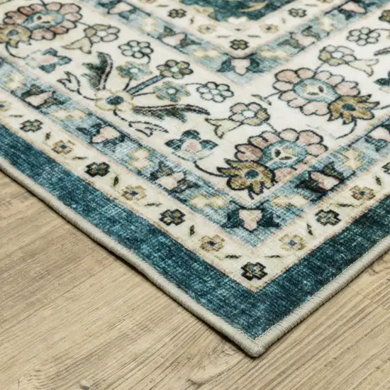 Teal And Ivory Oriental Distressed Area Rug Photo 9