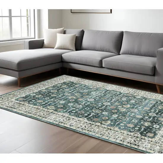 Teal And Ivory Oriental Distressed Area Rug Photo 1