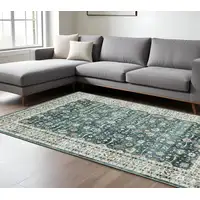 Photo of Teal And Ivory Oriental Distressed Area Rug