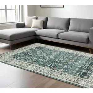 Photo of Teal And Ivory Oriental Distressed Area Rug