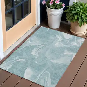 Photo of Teal Blue And Aqua Abstract Washable Indoor Outdoor Area Rug