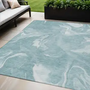 Photo of Teal Blue And Aqua Abstract Washable Indoor Outdoor Area Rug