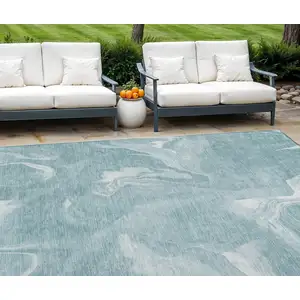 Photo of Teal Blue And Aqua Abstract Washable Indoor Outdoor Area Rug