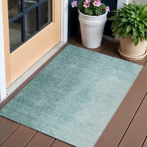 Photo of Teal Blue And Aqua Abstract Washable Indoor Outdoor Area Rug