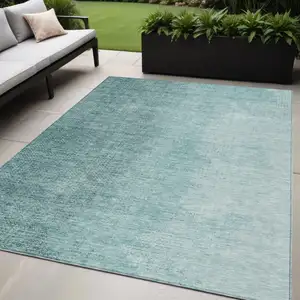 Photo of Teal Blue And Aqua Abstract Washable Indoor Outdoor Area Rug