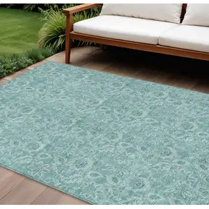 Photo of Teal Blue And Aqua Floral Washable Indoor Outdoor Area Rug